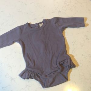 Kate Quinn, ruffled hip, long sleeve onesie
